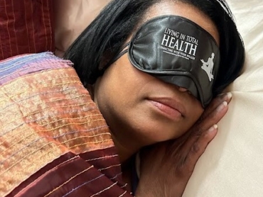 Glen Alex asleep in the Living In Total Health Sleep Mask